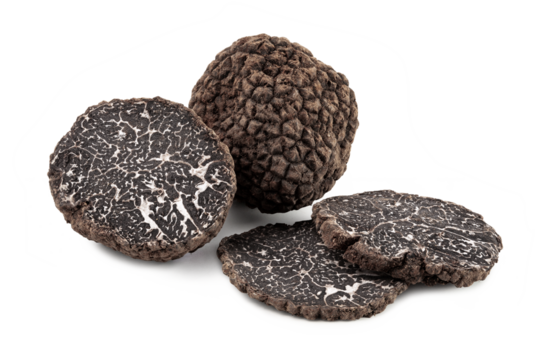 black truffles with slices on white background.
