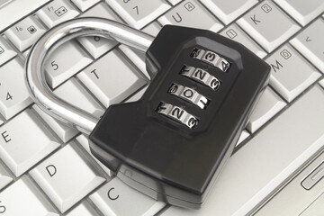 Data security in 2023 concept. Padlock with numbers 2023 on  laptop computer keyboard close up.