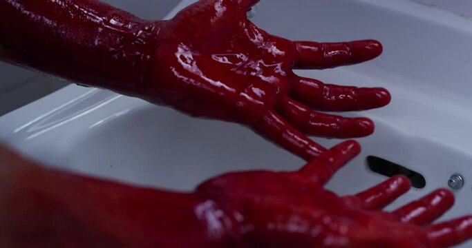 Hands, horror and clean blood in bathroom or crime, violence and cleaning murder evidence or death, criminal and killer. Person, red bloody hand and washing scary gore from disaster or accident