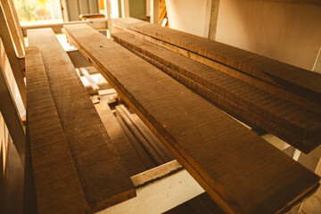 wood board material industrial, using with carpenter machine equipment for wooden business construction factory, work about natural wood plank texture pattern in brown color, wooden stack background