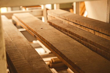 wood board material industrial, using with carpenter machine equipment for wooden business construction factory, work about natural wood plank texture pattern in brown color, wooden stack background