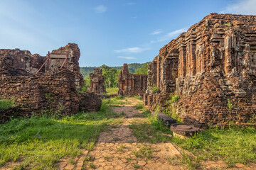 Fototapeta premium MY SON SANCTUARY IS A LARGE COMPLEX OF RELIGIOUS RELICS COMPRISES CHAM ARCHITECTURAL WORKS. A UNESCO WORLD HERITAGE SITE IN QUANG NAM, VIETNAM. LOCATED ABOUT 30 KM WEST OF HOI AN ANCIENT TOWN.