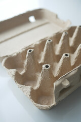 egg carton without eggs on table ,