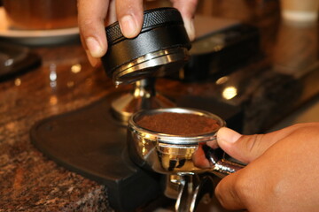 Fototapeta na wymiar Barista is preparing roaster coffee
