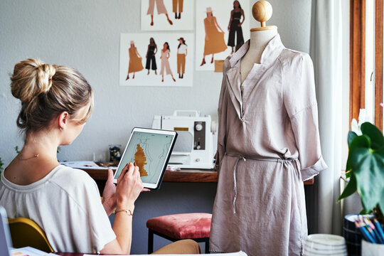 Fashion, woman drawing design on tablet with mannequin, small business ideas and creative process in studio. Creativity, textile and designer working on digital sketch with pattern and illustration.