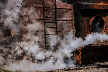 The rusty building serves as a formidable backdrop, reflecting the devastating effects of fire and...