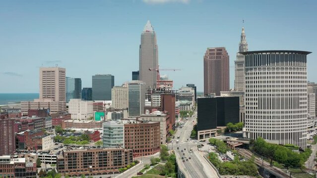 Cleveland Ohio downtown skyline 4K drone up left orbit wide