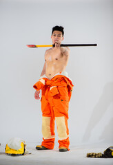 In a powerful stance the topless firefighter showcases their strength and determination as they firmly hold an iron axe ready to face any obstacle that comes their way on a pristine white background.