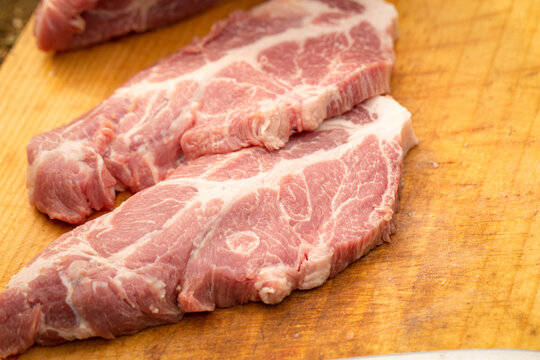 Raw neck on chopping board	