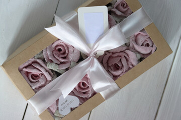 Zephyr flowers. Roses from marshmallows. Packed in a craft box. Close-up.