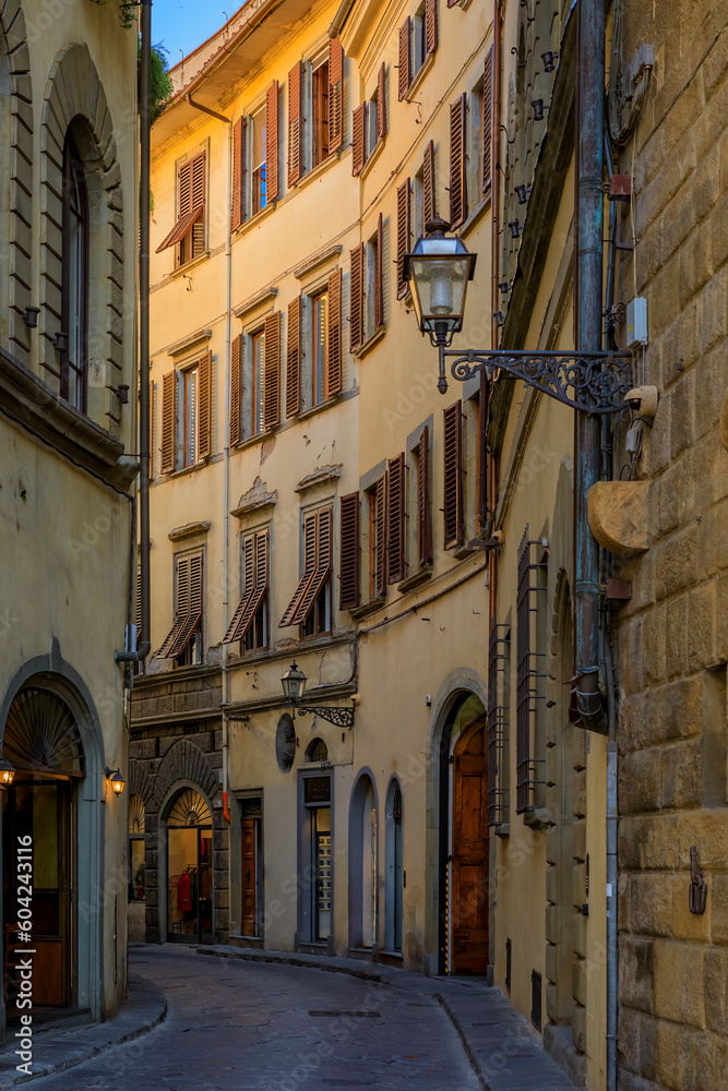 Wall mural Gothic buildings on a narrow street in Centro Storico of Florence, Italy