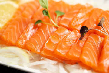 Raw salmon sliced on a plate