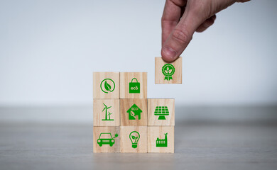 Net zero action concept. Save energy, green energy, reduce carbon footprint, carbon capture. Climate neutral long term strategy. Limit global warming. Putting wooden cubes with green net zero icon