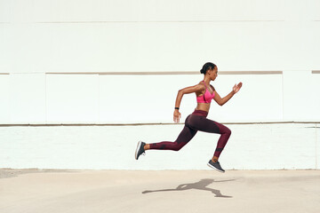 Woman, fitness and running on mockup for training, exercise or healthy cardio workout outdoors....