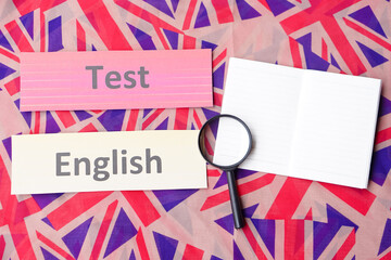 Word cards English Test, magnifying glass and notebook paper.Concept, language learning. Find English correct answers. Education. School subjects. Evaluations.           