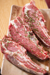 Seasoned lamb ribs on a plate