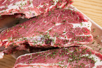 Seasoned lamb ribs on a plate