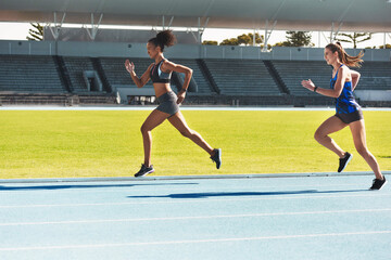 Woman, running and stadium track for race, competition or fitness athletics in the outdoors. Fit, active or sporty women, runner or sprinting in exercise, workout or training for healthy cardio