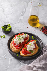 bruschetta with tomatoes and strachatella cheese