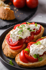 bruschetta with tomatoes and strachatella cheese
