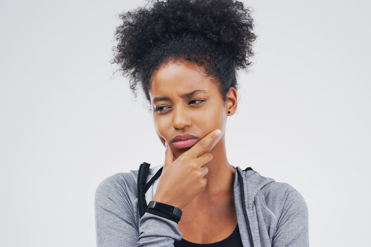 Isolated, black woman and serious thinking of workout idea, fitness or planning exercise and health goals. Girl, think or plan decision for training, gym or remember sport ideas on white background