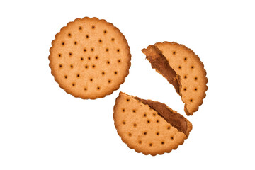 Whole and broken biscuits on a white background. Round cookies.