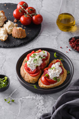 bruschetta with tomatoes and strachatella cheese