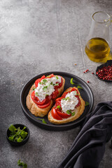 bruschetta with tomatoes and strachatella cheese