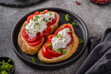 bruschetta with tomatoes and strachatella cheese