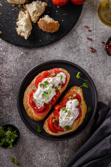 bruschetta with tomatoes and strachatella cheese