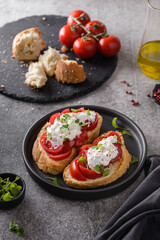 bruschetta with tomatoes and strachatella cheese