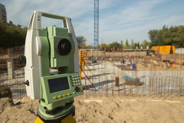 Close up view of technology equipment for measuring at construction site. Robotic total station...