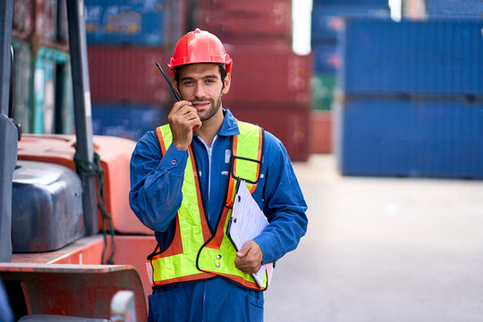 Smart foreman use walkie talkie in container site for communicate with team