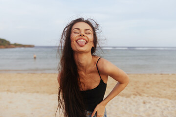 Fototapeta na wymiar sea woman sand vacation summer smile beach lifestyle sunset peaceful ocean