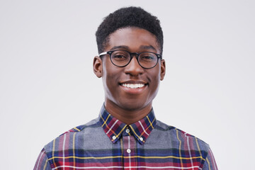 Smile, portrait of black man with glasses and happy against a white background. Nerd or geek,...