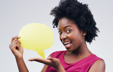 Happy black woman, portrait and speech bubble for social media, surprise or question against a white studio background. African female person with afro or sign for comment or FAQ on mockup space