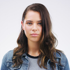 Face, serious portrait and a woman in studio with healthy skin, natural beauty and cosmetics. Headshot of a young female model with a facial expression isolated on a white background from Canada