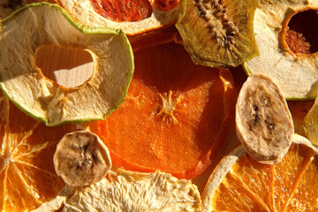 Dried fruits. Assorted of healthy sundried organic fruit spinning on wooden background. Snacking...