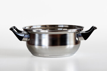 Small metal saucepan on a white background