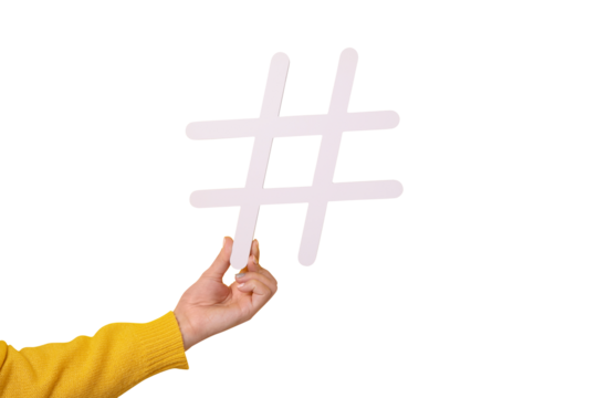 hand holding big white hash sign, hashtag symbol of internet trends and popular blogs, recommendation to follow social media content isolated on transparent background - Powered by Adobe