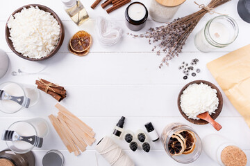 Set for crafting candle on wooden background. Eco soy wax and candle making tools top view, flat lay