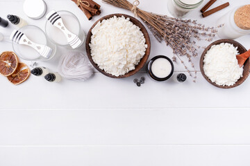 Set for crafting candle on wooden background. Eco soy wax and candle making tools top view, flat lay