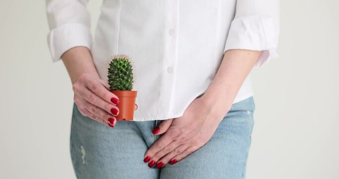 Female body and cactus against background of internal organs symbolizes female pains. Uterus and ovaries and pain