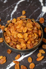 Raisins. Sun-dried grapes in bowl. superfood. Vegetarian food concept. healthy snacks. close up