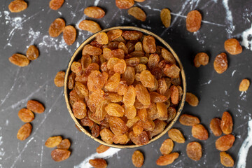 Raisins. Sun-dried grapes in bowl. superfood. Vegetarian food concept. healthy snacks. Top view