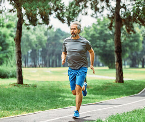 senior fitness man active sport exercise running jogging healthy runner fit jogger workout athlete...