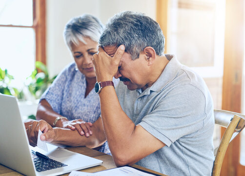 Debt, stress and senior couple with finance bills, paperwork and insurance documents on laptop. Retirement, anxiety and elderly man and woman worry for mortgage payment, investment and budget at home