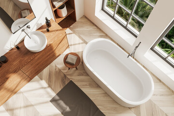 Top view of light bathroom interior with bathtub, sink and panoramic window