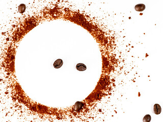 Closeup shot of coffee powder circle isolated on white background with roasted coffee beans.