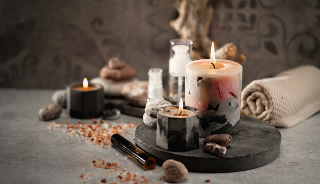 wellness salon concept, burning candles, stones, salt, spa, relaxation